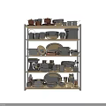 Modern Kitchen Cookware Collection On Shelves With Stainless Steel Utensils And Pots
