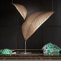 Elegant Water Fountain with Golden Leaf Shaped Structures and Green Striped Decor on Dark Background