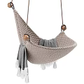 Beige Knitted Hanging Chair With Wooden Accents And Gray Fringed Blanket