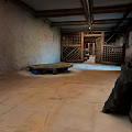 Traditional Building Interior With Wooden Beam Ceiling Latticed Door Weathered Walls And Wooden Table