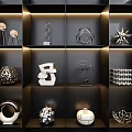Elegant Decorative Ornament Set on Dark Shelves with Various Geometric Designs and Illuminated