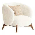 Cream Colored Fluffy Single Seater Sofa With Geometric Patterned Cushion And Dark Brown Wooden Legs
