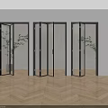 Modern Interior Folding Doors With Black Frame Glass Light Walls Wooden Floor And Green Plant