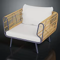 Modern Minimalist Rattan Armchair With White Cushion And Metal Frame Design