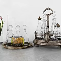 Elegant Glass Wine Decanters and Glasses on Silver Metal Tray with Decorative Vase and Candles