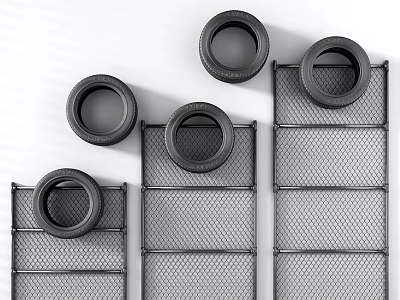 Multiple Black Tires Arranged On Metal Mesh Storage Racks For 3d model