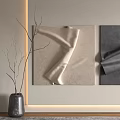 Beige And Dark Gray Fabric Wall Hangings With Gray Vase And Branches On Light Wall