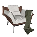 Modern Brown Leather Armchair With Light Gray Fabric Cushions And Green Throw Blanket