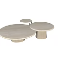 Three Light Colored Wooden Round Coffee Tables With Pedestal Base And Minimalist Design