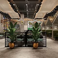 Modern Restaurant Interior With Unique Ceiling Pendant Lights Black Metal Partitions And Green Plants
