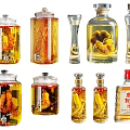 Various Glass Wine Bottles and Drinking Glasses with Herbal Infusions and Liquor