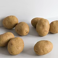 Fresh Brown Potatoes Scattered on White Surface with Natural Skin Texture