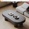 Modern Oval Coffee Table In Living Room With Magazine Bowl And Sofa
