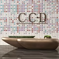 Sleek Modern Reception Desk On Colorful Geometric Wall With CCD Logo Green Cushion And Plant