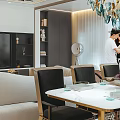 Modern Living and Dining Room Interior With Blue Glass Chandelier White Sofa And Large Windows