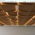 Wooden Ceiling with Geometric Panel Design and Recessed Lighting Details