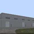 Modern Industrial Factory Building With Gray Exterior Multiple Windows Roller Doors And Green Landscaping