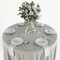 Elegant Dinnerware Set with White Flower Bouquet Candles Gray Tablecloth Plates Cutlery Wine Glasses