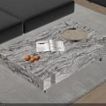 Marble Texture Coffee Table With Oranges Magazine Tray Glass And Grey Sofa