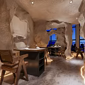 Unique Restaurant Interior Design With Cave Like Ceiling Blue Art Bar Counter And Black Stools