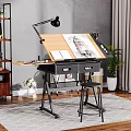 Art Supplies On Wooden Drawing Desk With Drawing Board Open Notebook Stool And Potted Plant