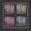 Colorful Candy Granules Stored in Transparent Bags with Labels Inside a Pink Box