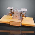 Vintage Bench Grinder Equipment on Yellow Wooden Base with Dark Background and Reflection