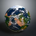 Realistic Earth Globe With Blue Oceans Green Landmasses And White Clouds