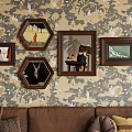 Abstract Paintings In Framed Artworks On Patterned Wallpaper Living Room With Brown Sofa And Cushions