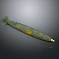 Green Military Bomb With Tail Fins And Yellow Markings On Gray Background