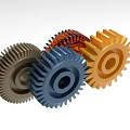 Three Different Colored Industrial Gears Used In Mechanical Equipment Systems