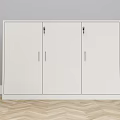 White Storage Cabinet With Three Doors And Gold Handles On Wooden Floor Against Gray Wall