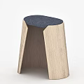 Modern Wooden Stool With Blue Cushioned Seat And Natural Wood Grain Design