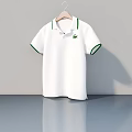 White Polo Shirt With Green Collar Cuff Trim Hanging On Wooden Hanger