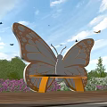 Butterfly Shaped Landscape Bench In Garden With Flowers And Blue Sky