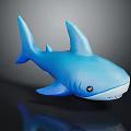 Blue Shark Toy Figure With Fin Tail and Black Eyes on Reflective Black Surface