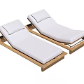Two Outdoor Lounge Chairs With White Cushions And Wooden Frames
