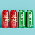 Red And Green Canned Beverages Including Red Bull Energy And Yanjing Beer On Blue Background