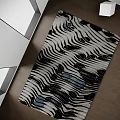 Square Rug With Black And White Striped Pattern And Blue Accent Spots On Wooden Floor