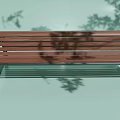 Outdoor Garden Bench With Wooden Slats And Metal Frame In Tree Shade