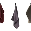 Assorted Colored Towels Hanging On Wooden Rods For Home Bathroom Decor