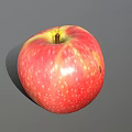 Juicy Fresh Ripe Red Apple With Yellow Streaks Speckled Surface On Gray Background