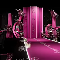 Pink Wedding Banquet Hall With Decorative Flowers Walkway Lighting And Dark Backdrop