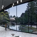 Residential Landscape View From Indoor Large Glass Windows With Trees Pond And Stone Arch Bridge