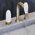 Contemporary Stylish Faucet Designs in Brushed Gold and Chrome with Smooth Water Flow on Countertop Surfaces