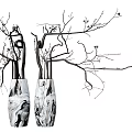 Two Black and White Marble Vases with Decorative Branches and Small Flowers