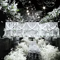 Banquet Hall with White Floral and Hanging Bubble Decorations White Drapery Backdrop and Lighting