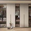 Modern Walk in Closet Interior With Glass Doors Hanging Clothes And Storage Cabinets