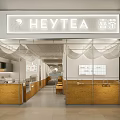 Modern Bright HEYTEA Milk Tea Shop With Glass Facade Wooden Counter And Seating Area