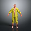 Man In Yellow Open Front Tracksuit With Striped Pants Barefoot On Grey Background